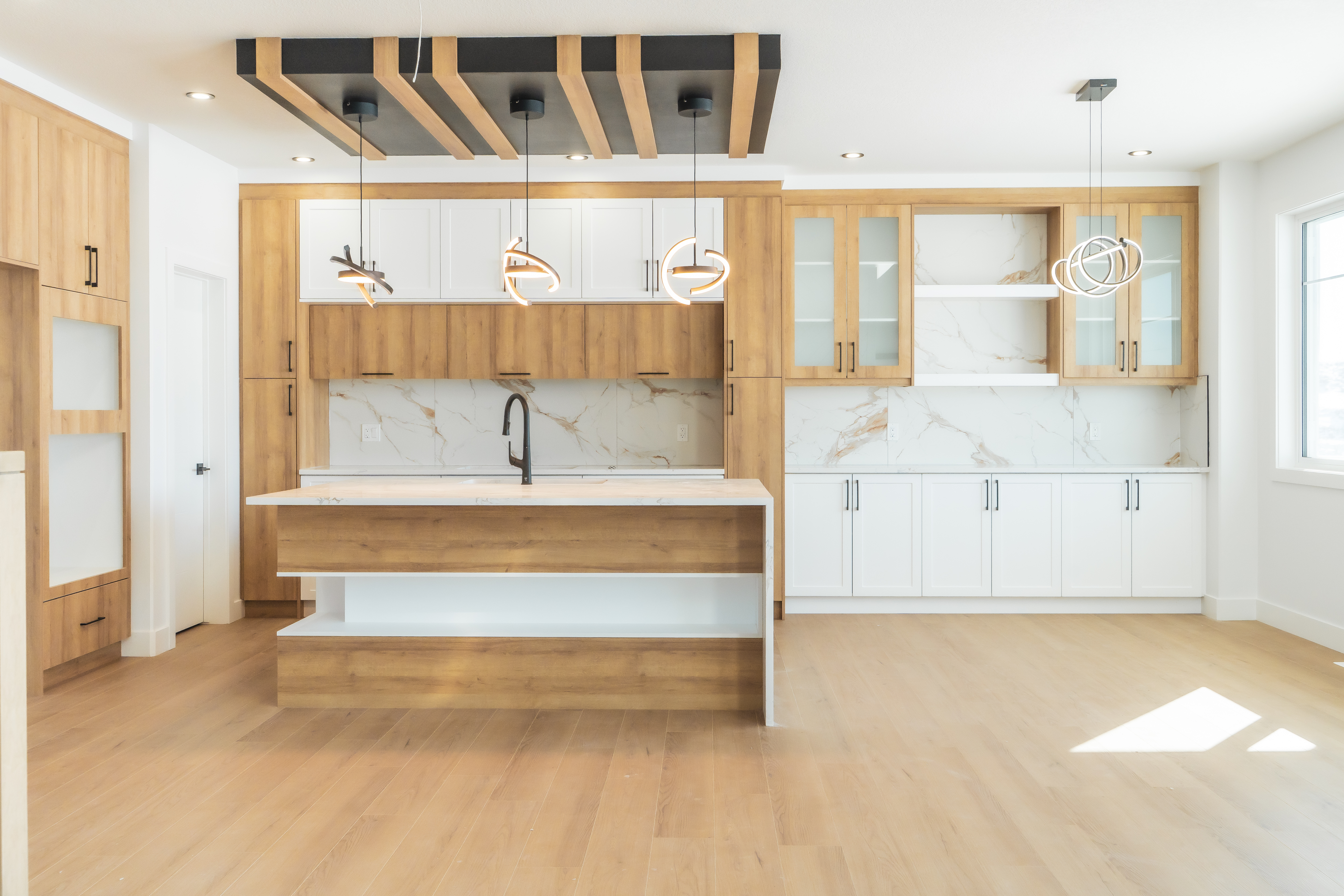 Modern kitchen design with island seating – ACE Custom Cabinets